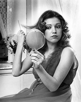 Images Dated 18th November 2016: Young woman in nylon nightie