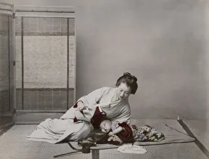 Young woman playing with her baby