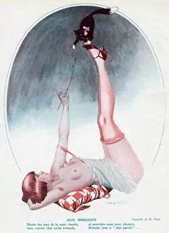 Young woman playing with her kitten