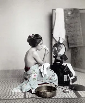 Geisha Prints: Young woman putting on makeup at a mirror, Japan, c. 1880 s