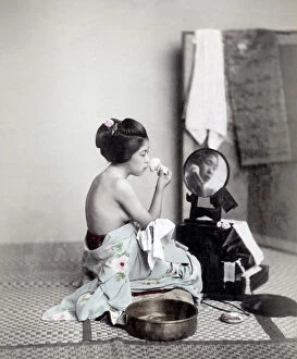 Meiji Gallery: Young woman putting on makeup at a mirror, Japan, c.1880 s