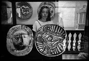 Picasso Prints: Young woman reflected in case of Picasso ceramics, Valencia