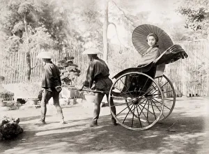 Rickshaw Collection: Young woman in a rickshaw, jinrikisha, Japan