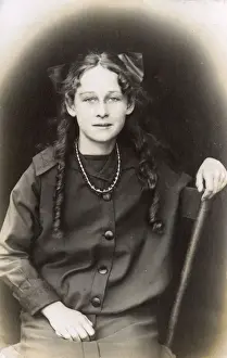 Teenager Prints: Young woman with ringlets and bow, USA