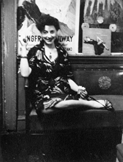 Images Dated 28th February 2012: Young woman sitting on a bench