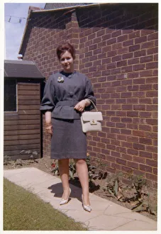 Images Dated 4th February 2021: Young woman in a smart two piece dark grey outfit