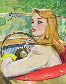 Images Dated 7th September 2017: Young woman at the wheel of a car