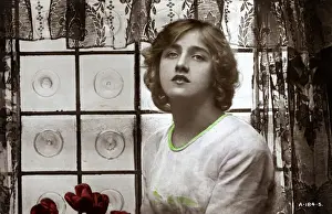 Young woman in front of window