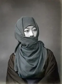 Young woman in winter costume, Japan, circa 1880s