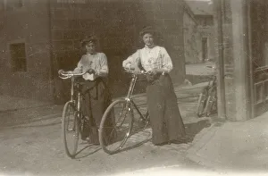 Two young women pose proudly with their bicycles at Moffat in Dumfriesshire Two young women pose proudly with their bicycles at Moffat in Dumfriesshire