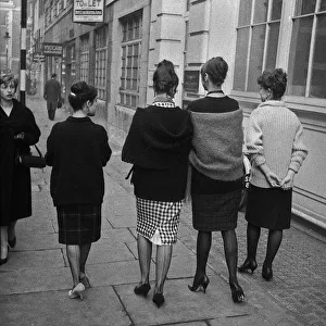 Images Dated 27th April 2021: Four young women walking along a street, London