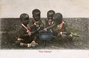 Eats Gallery: Four young Zulu children enjoy an early breakfast