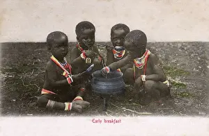 Zululand Prints: Four young Zulu children enjoy an early breakfast