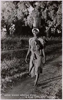 Carry Prints: Zambia (Northern Rhodesia) - Woman carrying water