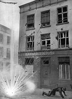 A special Sphere diagram combining a photograph of bomb damage on a building in Antwerp with an added illustration of the bomb, dropped from a German Zeppelin, exploding on impact with the ground. The fragments fly upwards and greater damage is done to the upper level of the building than the ground floor fa硤e. Citizens of Liege were advised to throw themselves to the ground when they heard bombs approaching, thus supposedly reducing the risk of injury from the bomb shrapnel. Date: September 1914 Zeppelin bomb explosion diagram