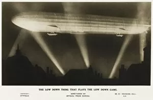 Zeppelin illuminated by searchlights
