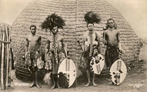 Four Zulu Warriors in traditional costume